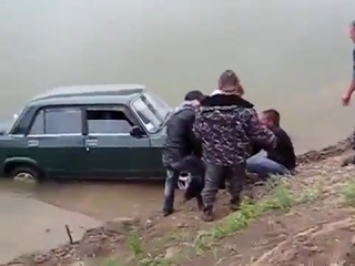 by car in the river. the assholes drowned the car. fun with cars.